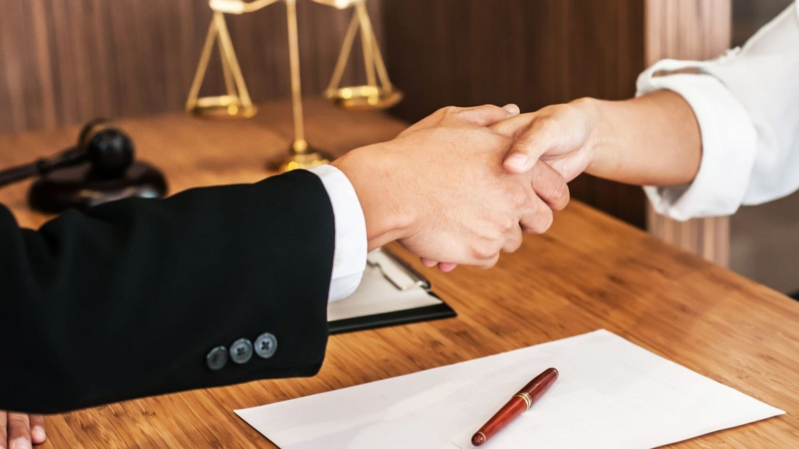 Broward County estate planning attorney handshake with Fort Lauderdale and Hollywood client